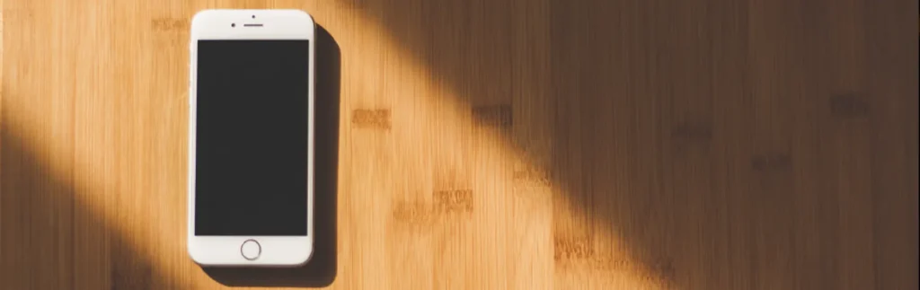 mobile phone on wood